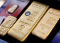 Gold eases as robust US payrolls boost rate-hike bets; inflation data in focus